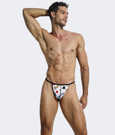 Hipster g-string print mens thong in white briefs with red black and blue playing card suit design on white background