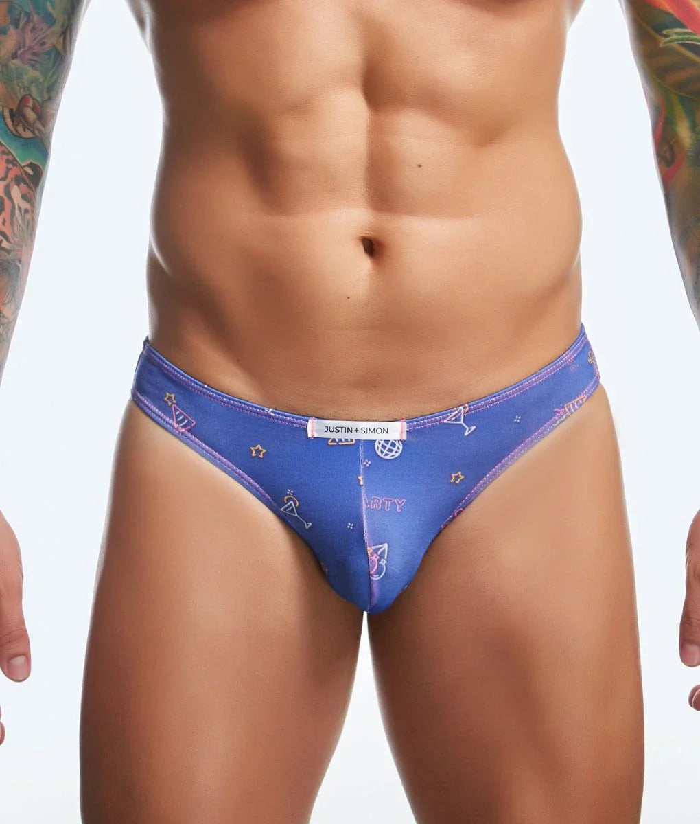 Blue Justin Simon classic mens bikini briefs with playful pink and white stars cocktail glasses and abstract prints