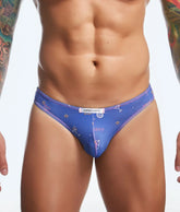Blue Justin Simon classic mens bikini briefs with playful pink and white stars cocktail glasses and abstract prints