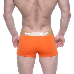 Bright orange men’s briefs with a gold metrwear waistband designed for comfort and style by MetroMaleWear