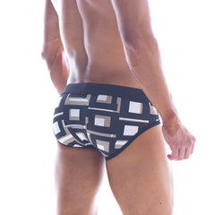 MetroMaleWear black swim brief 4916-33 featuring bold white and beige geometric pattern for stylish beachwear