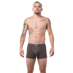 Dark gray men’s sheath 2.1 dual pouch boxer briefs with a subtle white logo on the waistband in a 3 pack bundle