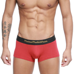 Red cotton briefs with a terracotta hue and black waistband featuring gold metromalewear lettering