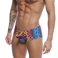 Metro male wear cannon boxer neon swim trunks with vibrant multicolored leopard-print and pink blue yellow gradient design
