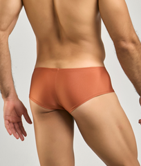 A sleek rust-orange Justin Simon cheeky bulge boxer with smooth form-fitting design for comfortable wear