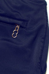 Navy blue bondi short made of nylon featuring a gold-toned zipper pull with an oval ring design