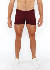 Maroon 3 inch stretch knit duo tone shorts with form fitting design, button closure, and side pockets