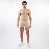 Beige 3 inch stretch knit chino shorts with classic button closure and tailored fit for comfortable wear