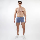 A pair of men’s light blue slim-fit 3 inch stretch knit shorts with classic five-pocket design and button closure