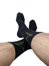 4 rth black sport socks featuring black crew design with subtle green fern embroidery on the side
