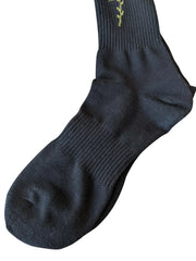 4 rth black sport sock made of ribbed knit material with small olive green embroidered vine near the cuff