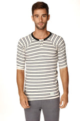 A men’s short-sleeved white and black striped henley shirt with ribbed collar and three-button placket in French Terry