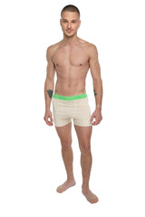 Performance yoga leggings short sand beige with cream-colored boxer briefs and bright green elastic waistband shown