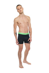 Black performance yoga leggings short with vibrant neon green waistband for activewear in carbon black color