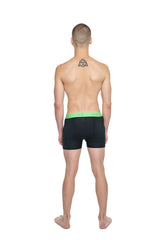 Black boxer briefs with bright green elastic waistband designed for performance yoga and short workouts in carbon black