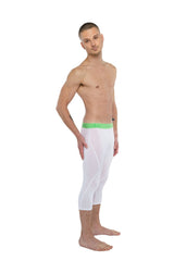 White capri-length performance yoga leggings in arctic white with bright green elastic waistband for active wear