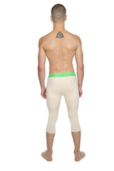 Performance yoga leggings 3/4 in sand beige with bright green elastic waistband and cream-colored capri fit