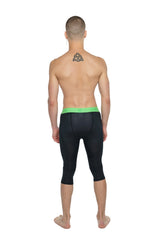 Performance yoga leggings 3/4 in carbon black with bright green waistband made for compression and flexibility