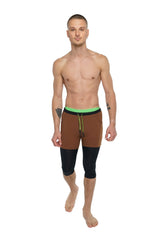 Brown and black two-tone 3/4 performance yoga leggings with neon green waistband in carbon black for athletic use