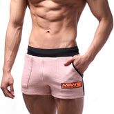 Metro male wear cotton pink athletic shorts with black waistband side trim and orange logo patch on front pocket