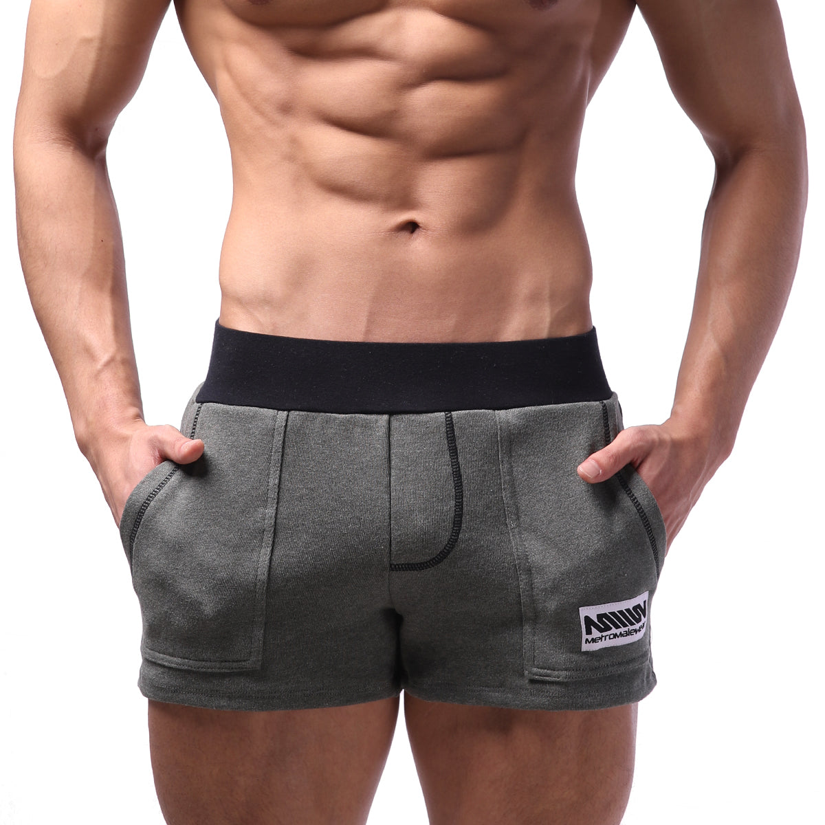 Gray metro malewear boston athletic shorts with black elastic waistband and white logo patch on lower right leg