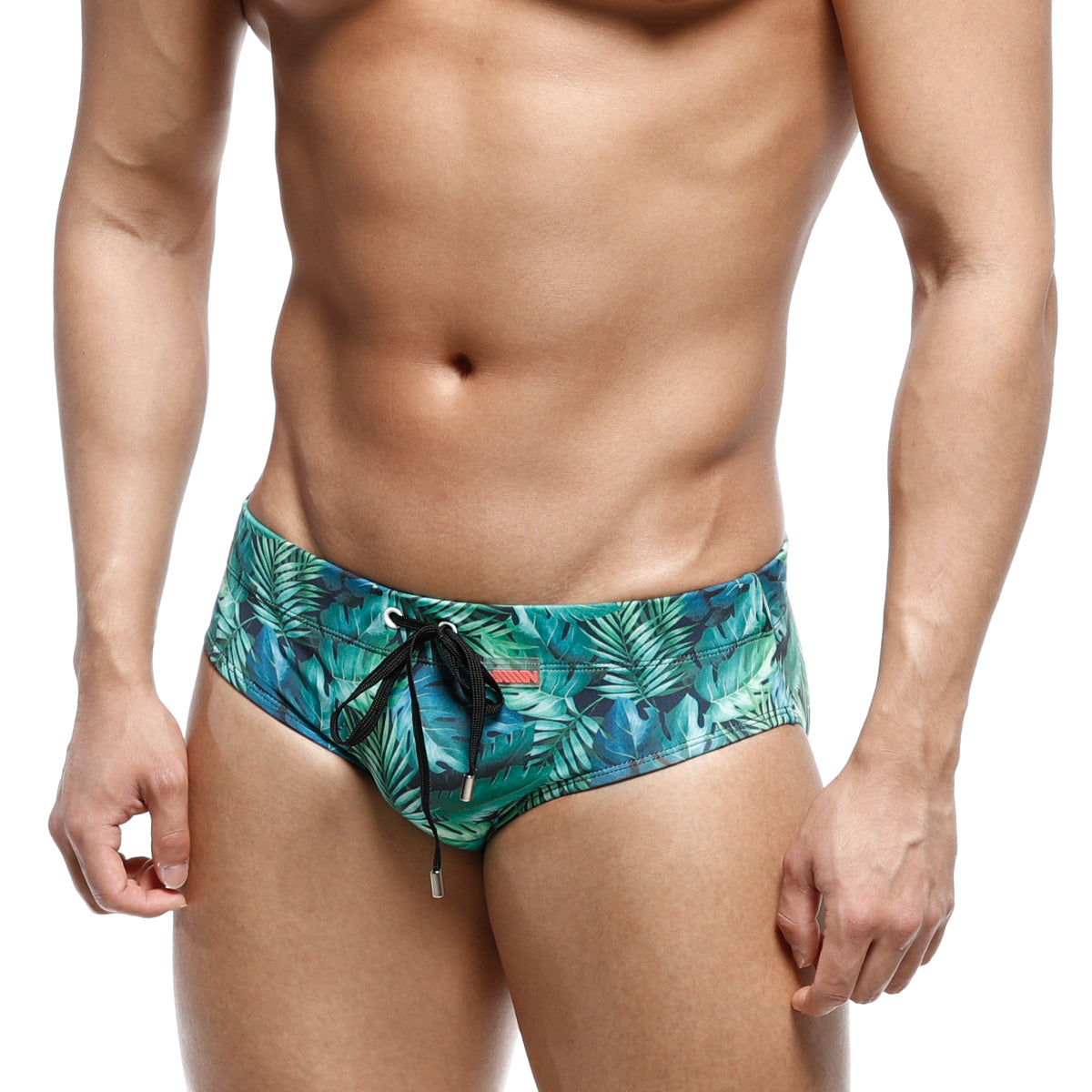 Men’s swim trunks metroMalewear classic swim brief jungle 4914-08 with vibrant teal green tropical leaf pattern and black drawstrings
