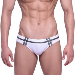 White swim trunks by metromalewear duque with black striped detailing for stylish beachwear and swimming