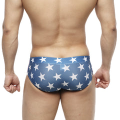 Blue metro-malewear classic swim brief with white star pattern designed for comfortable swimwear use