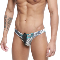 MetroMaleWear classic men’s swim trunks with bold teal black and white tropical leaf pattern and black drawstring