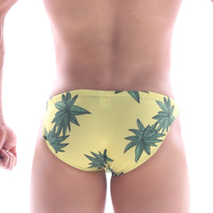 Yellow metro male wear classic swim bikini featuring green cannabis leaf pattern on swim trunks fabric