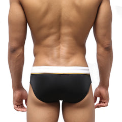 MetroMaleWear Edge swim brief in black with a white waistband and thin gold trim designed for swimming