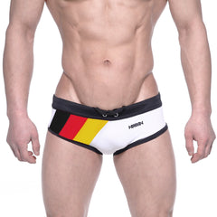 White swim trunks with black trim and bold german flag design on the side featuring ammy branding metroMalewear 4960-41