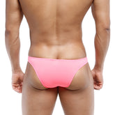 A vibrant pink form-fitting brief-style swimsuit from metromalewear bulge capri bikini fuchsia 6104-02