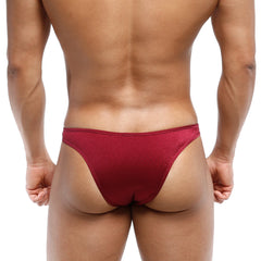 A sleek deep red metro malewear bulge capri bikini made of smooth stretchy fabric with subtle sheen