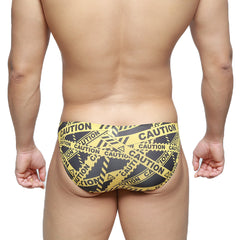 Metro malewear caution lowrise bikini swim trunks in yellow and black caution tape pattern for bold beachwear