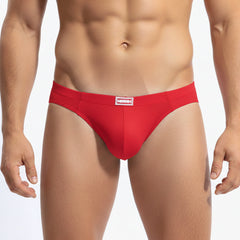 Red mesh briefs with a white rectangular logo patch on the waistband from metromalewear bravo bikini red 7103-12