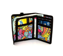 A vibrant black-trimmed 80s velcro tri-fold wallet with colorful cartoon creatures and bold outlines pattern