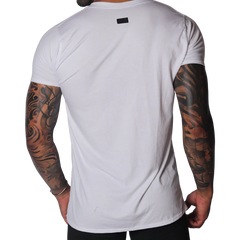 Back view of a plain white crew neck cotton T-shirt featuring a small black rectangular brand logo at the nape.