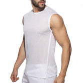 A man wearing a white mesh sports tank top, shown in a side profile.