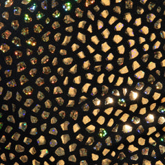 Black fabric gold stones trunk decorated with scattered gold and iridescent rhinestones in a mosaic pattern