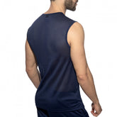 Rear view of a man wearing a navy blue Addicted sports mesh tank top against a white background.