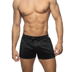 Black nexus button shorts with a drawstring waistband and subtle side stripes designed for athletic wear