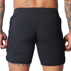 Rear view of black Gigo Ambitious athletic shorts featuring a flat waistband and minimalist, seamless design.