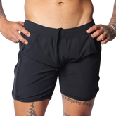 Black athletic shorts with an elastic drawstring waist, side pockets, and perforated panels on the side seams.