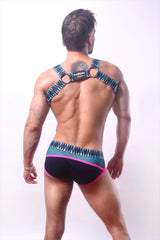 Back side of black and neon pink patterned briefs with blue geometric design and freakicks logo rough house harness
