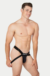 A model wearing the AWRY Menswear Apex Jock Thong in black against a plain background.