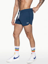 Navy blue bike track short with white drawstring and bike logo on the side designed for athletic use