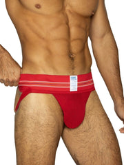 Red bike athletic briefs with striped waistband and white label featuring bike brand name in vibrant red color