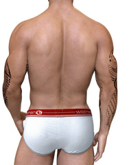 Muscular man seen from behind wearing white Wildman Big Boy pouch briefs with a red logo waistband and grey trim.