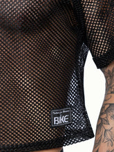 Black mesh short sleeved practice jersey with subtle sheen and tailored for women by bike label visible